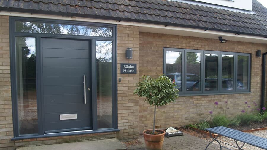 Black entry pivot door with sidelights