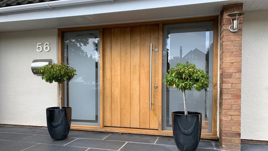 Wooden door panel entry pivot door