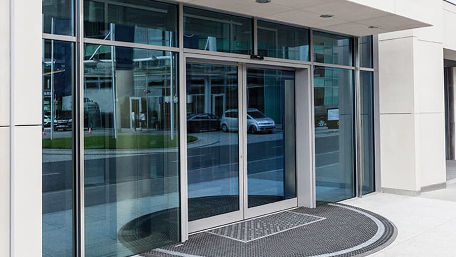 Hands-free automatic sliding glass business door