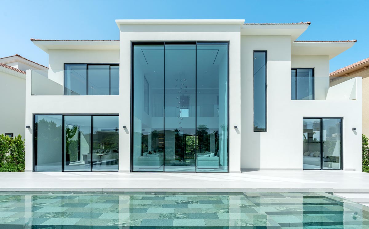 Luxury Villa Interior Facing Exterior Landscape Through Slim Frame Patio Door Luxury Villa Interior Facing Exterior Landscape Through Slim Frame Patio Door
