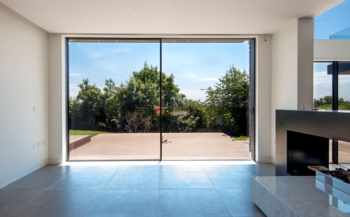 Black Frame Outdoor Patio Sliding Door Connecting Living Space to Deck Black Frame Outdoor Patio Sliding Door Connecting Living Space to Deck