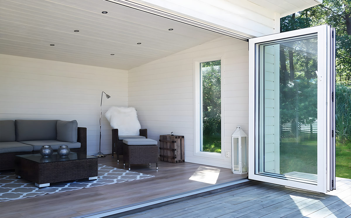 Luxury Villa Living Room with Corner Folding Glass Doors Facing Outdoor Greenery Luxury Villa Living Room with Corner Folding Glass Doors Facing Outdoor Greenery