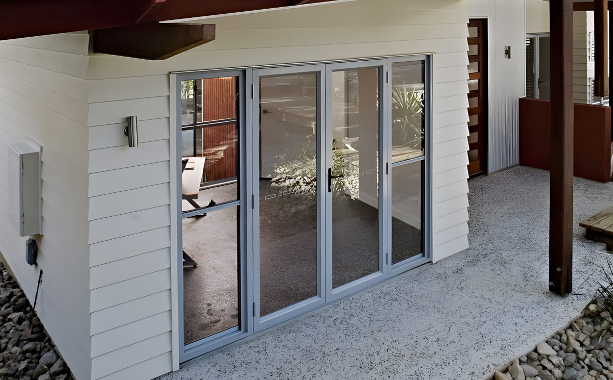 Modern aluminum French doors with dark slim profiles and full-vision glass panes Modern aluminum French doors with dark slim profiles and full-vision glass panes