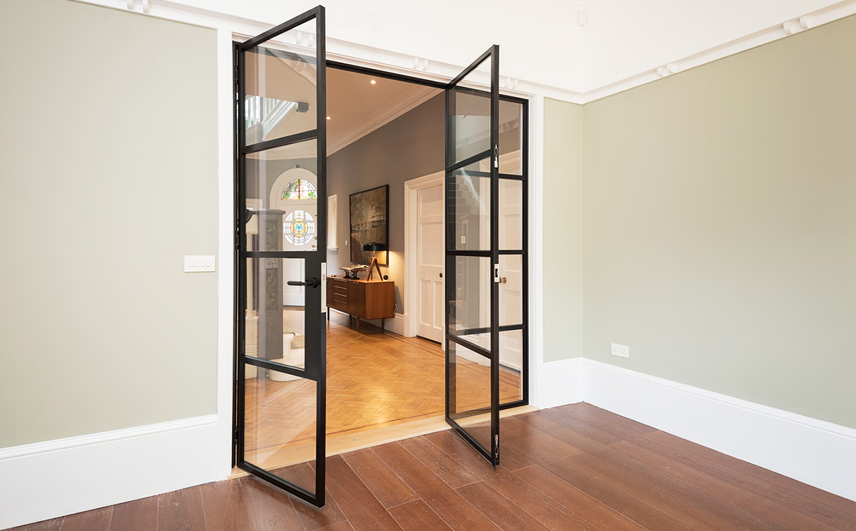 Modern black steel-look double glass doors in Crittall style for living room partition Modern black steel-look double glass doors in Crittall style for living room partition