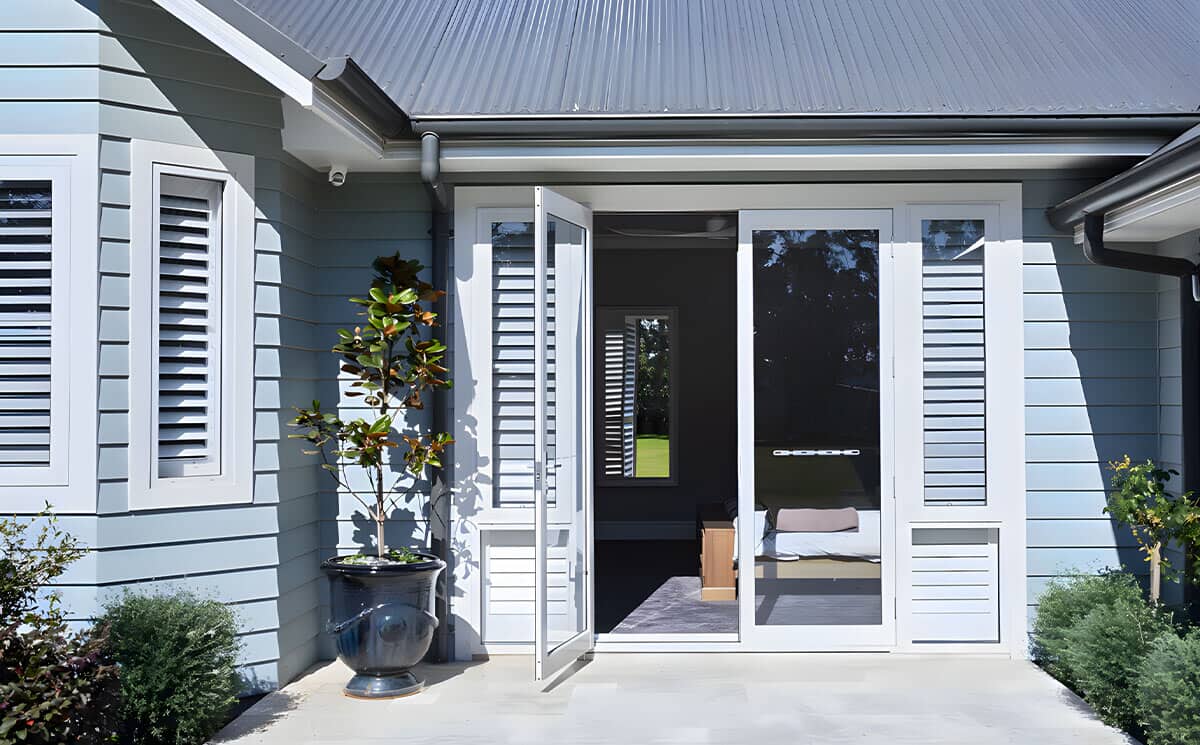 White aluminum exterior French doors with integrated louvered privacy sidelites for patio White aluminum exterior French doors with integrated louvered privacy sidelites for patio