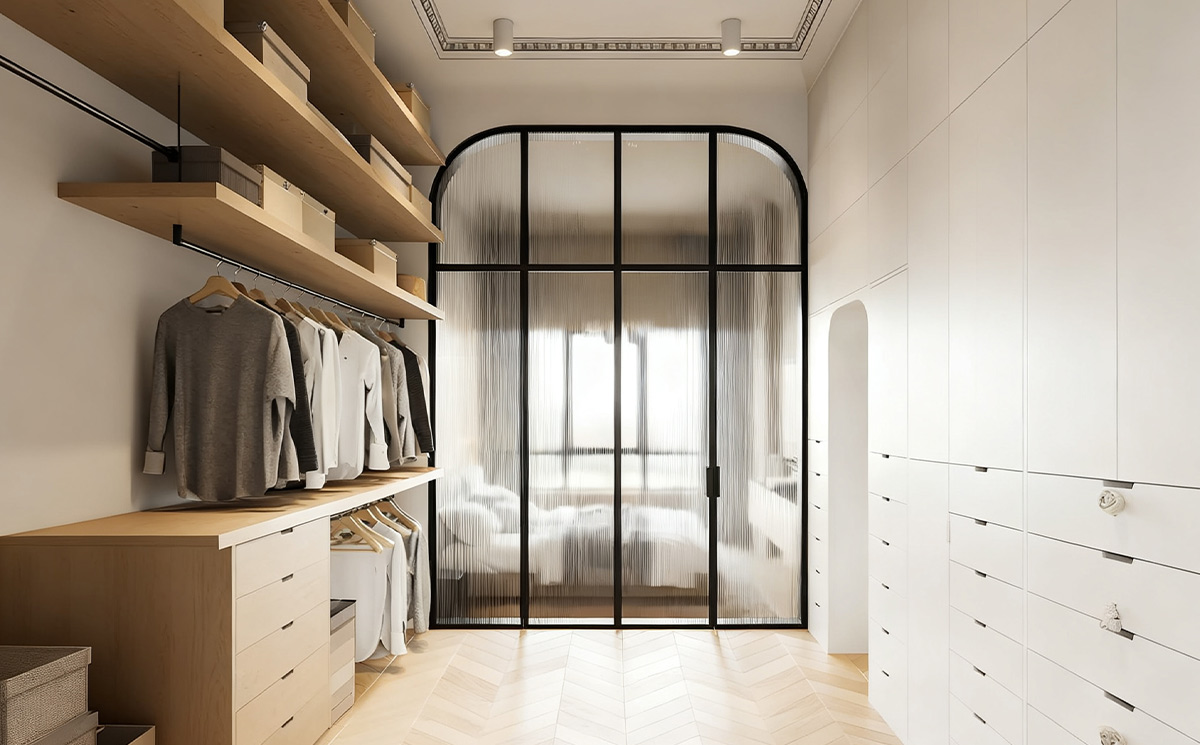 French style arched slim frame fluted reeded glass swing door partition separating a modern walk in closet from the master bedroom French style arched slim frame fluted reeded glass swing door partition separating a modern walk in closet from the master bedroom